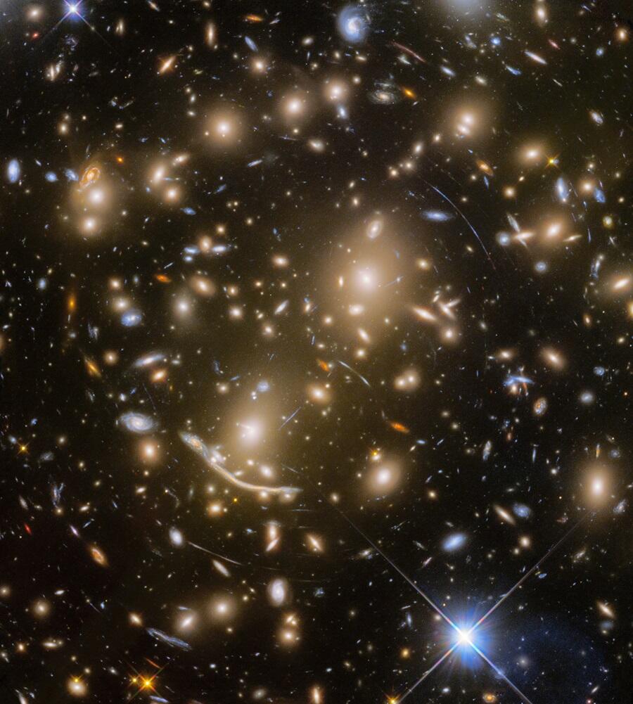 Assist. Prof. Fudamoto's team captured 40 distant stars in a galaxy from the universe's youth, using gravitationallensing to glimpse the secrets of the early